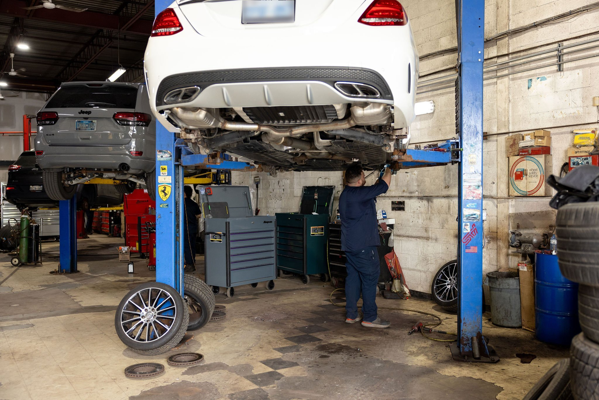Vehicle raised on a hydraulic lift