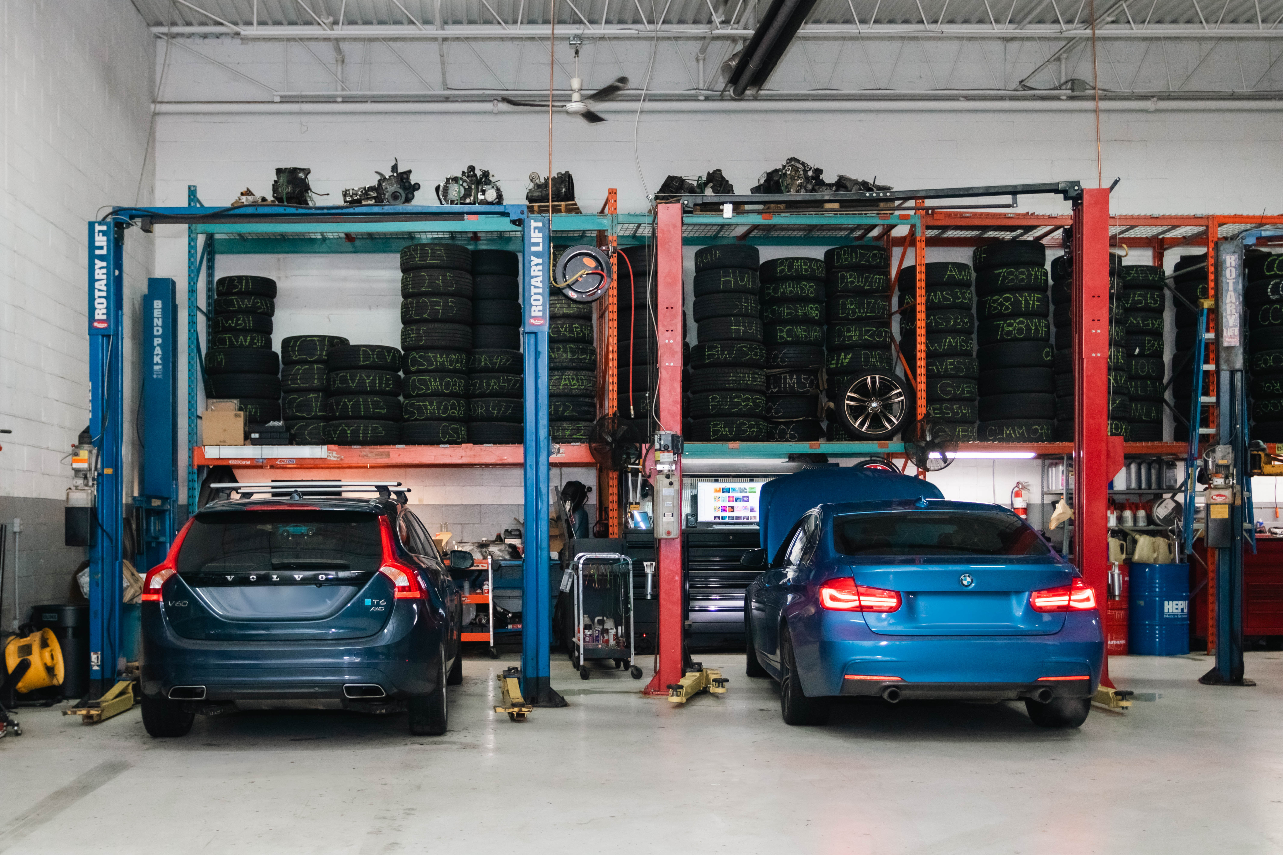 Tire shop with multiple vehicles on lifts