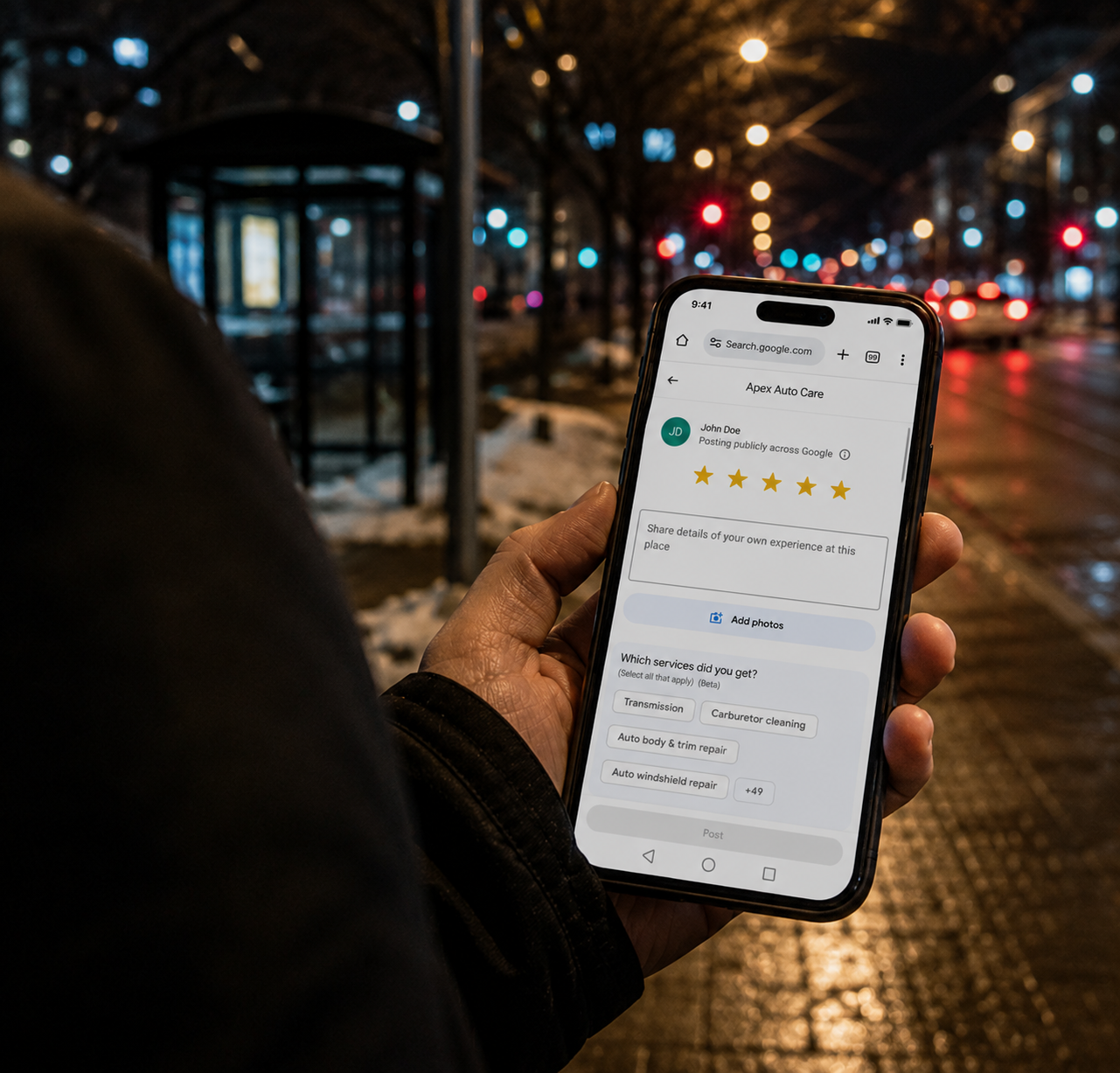 Person holding phone showing a Google review